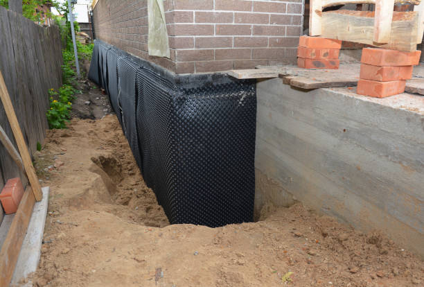 Happy homeowners after waterproofing job in Buchanan